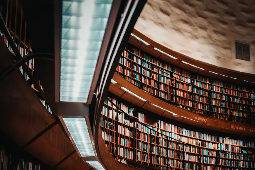 A curved law library filled with case-law volumes